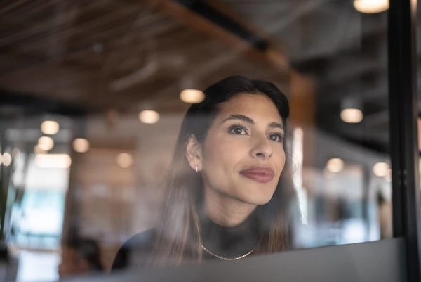 CMO Image Of Woman Looking Past Camera